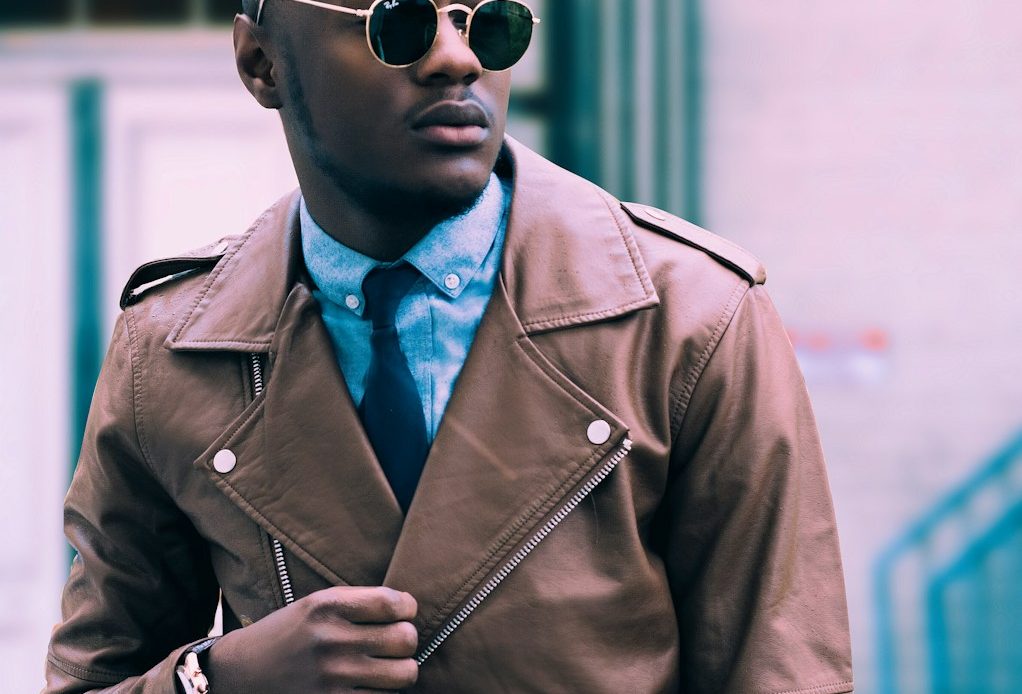 man in brown leather coat