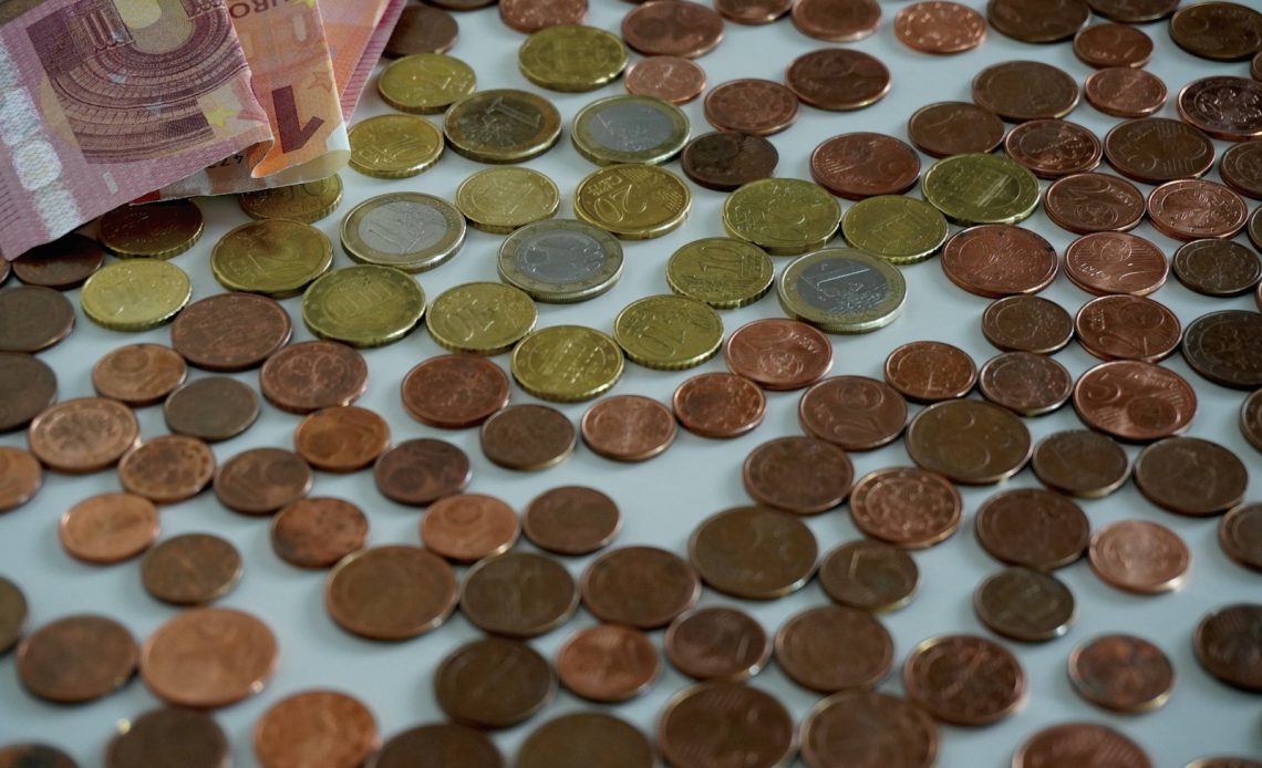 a pile of coins sitting on top of a table