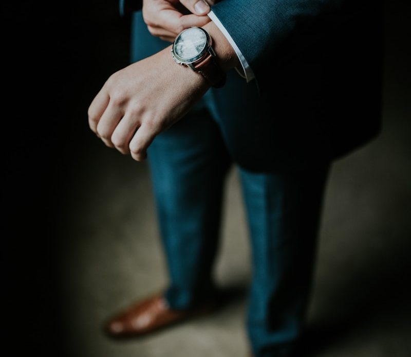 man holding his black suit